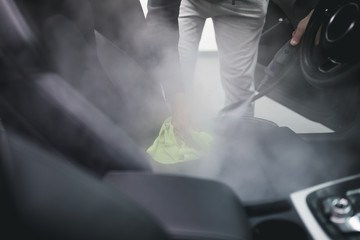 Cleaning interior of the car with hot steam