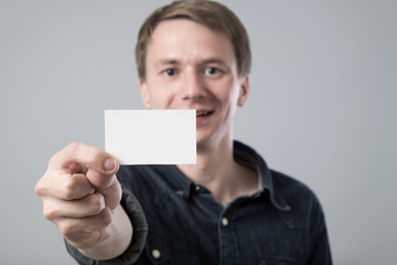 Young man on grey