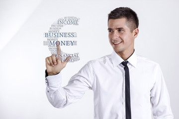 Euro sign - Young businessman touching word cloud