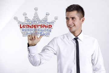 Leadership - Young businessman touching word cloud