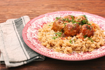 Meatballs in tomato sauce with rice in a bowl