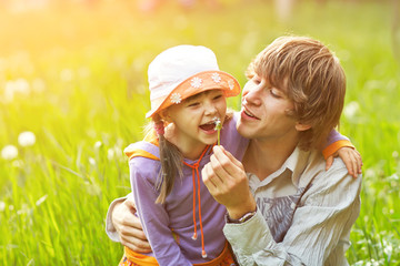 father and daughter for a walk summer day