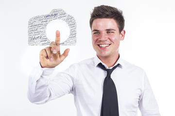 Image - Young businessman touching word cloud