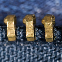zipper on jeans as a background. macro