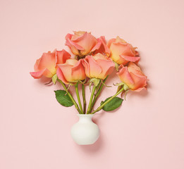 pink roses in white vase