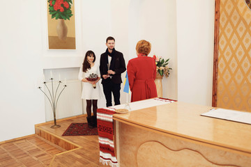 beautiful young bride and groom on the wedding ceremony