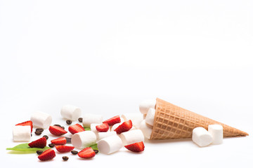 ice cream cone with marshmallow, coffee beans, strawberry and basil