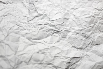 Crumpled white page of paper texture