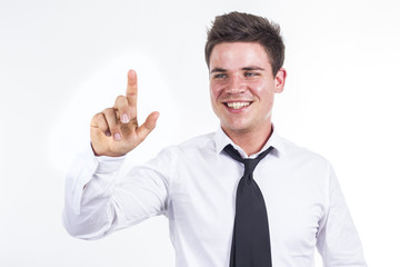 Young businessman touching transparent surface