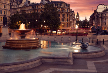 London Trafalgar Square fountain at sunset