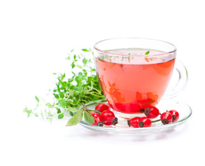 Fresh  tea with rosehip and thyme isolated on white