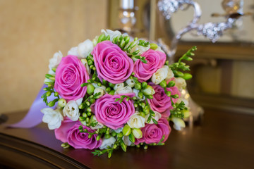 bouquet of pink roses on the table