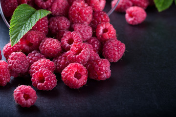 A bucket with scattered berries
