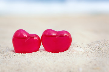 Valentines day card, hearts on beach