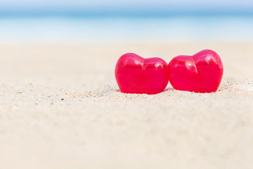 Fototapeta premium Valentines day card, hearts on beach
