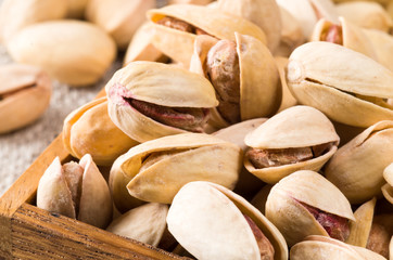 Macro close-up view of a group of salted pistachios