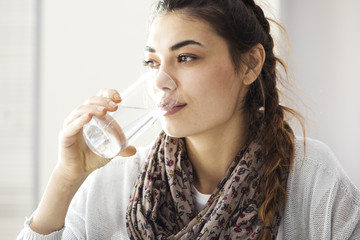 Young woman drinking water