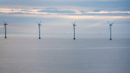 view of offshore wind farm in morning twilight
