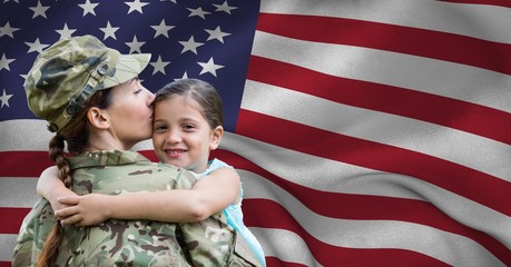 Army woman embracing her daughter