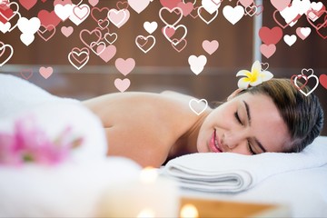 Woman in spa against digitally generated background