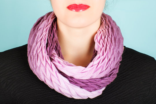 Lilac wool scarf around her neck isolated on white background.