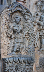 Fototapeta na wymiar Statues on the walls of Hindu temple