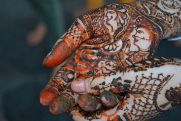 Woman hands with bridal mehndi tattoo