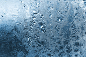 Frozen water drops on glass
