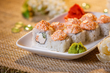 Traditional sushi rolls made of rice with caviar and sauce