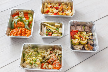 Healthy food take away, top view at wood background