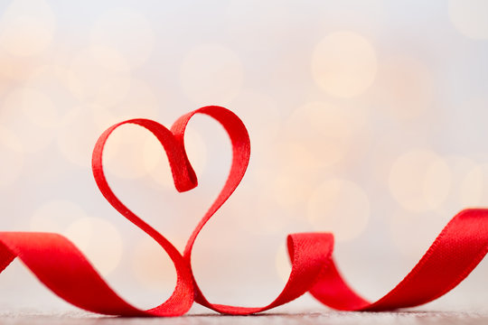 Red heart of ribbon. Valentines day background.