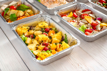 Healthy food take away, top view at wood background