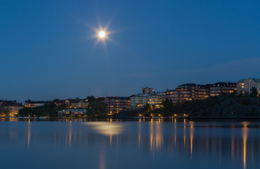 Fototapeta premium Moonlight over Stockholm, Sweden