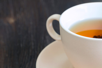 Light cup and saucer full of tea