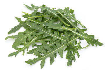 Close up studio shot of green fresh rucola isolated on white bac