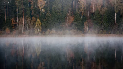 Zelfklevend Fotobehang misty countryside landscape with lake in latvia © Martins Vanags