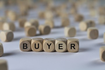 buyer - cube with letters, sign with wooden cubes