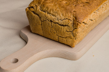fresh-baked bread on wooden plate