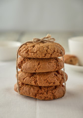 Homemade oat cookies with coffee on a wooden background
