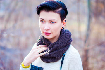 Calm girl with blue eyes and short black hair.