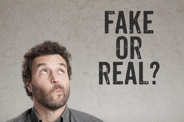 Man asking question for fake or real