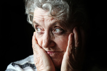 Grandmother portrait on a black background