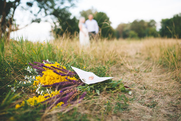 beautiful wedding flowers bouquet on the green grass