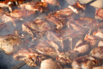 Cooking meat on the fire.