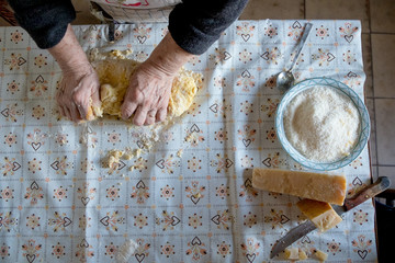  from above of old italian lady's making home made italian pasta