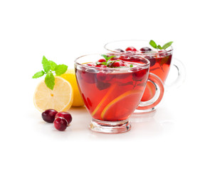 Red  fruit tea with lemon and cranberry isolated on white backgr
