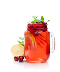 Red  fruit tea with lemon and cranberry isolated on white backgr