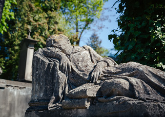 Fototapeta na wymiar Old statue on grave in Lviv