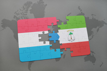 puzzle with the national flag of luxembourg and equatorial guinea on a world map