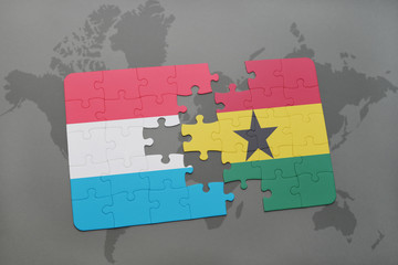 puzzle with the national flag of luxembourg and ghana on a world map